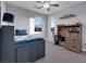 Bedroom featuring carpet floors, a large window and a desk at 9654 Starfish Reef Way, Las Vegas, NV 89178