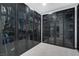 Walk-in closet featuring black cabinets with glass doors at 9654 Starfish Reef Way, Las Vegas, NV 89178