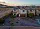 Aerial view of property showcasing solar panels, desert landscaping, and a brick paved driveway at 9654 Starfish Reef Way, Las Vegas, NV 89178