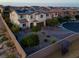 Aerial view showcasing solar panels, desert landscaping, and attractive brick driveway at 9654 Starfish Reef Way, Las Vegas, NV 89178