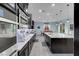 Modern kitchen features stainless steel appliances, large island, and granite countertops at 9654 Starfish Reef Way, Las Vegas, NV 89178