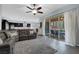 Open floor plan with living room view of the kitchen and outdoor dining area at 9654 Starfish Reef Way, Las Vegas, NV 89178