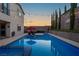 Beautiful backyard pool and spa area with lounge chairs and tranquil poolside ambiance at 9654 Starfish Reef Way, Las Vegas, NV 89178
