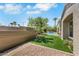 Landscaped backyard with artificial grass, gravel beds and a view of the pool and spa at 10277 Roma Madre Ave, Las Vegas, NV 89135