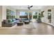 Bright and airy living room with large windows and comfortable seating at 10277 Roma Madre Ave, Las Vegas, NV 89135