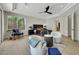 Bright main bedroom with seating area, floor-to-ceiling windows, and sliding doors to the yard and pool at 10277 Roma Madre Ave, Las Vegas, NV 89135