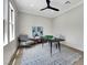 Bright office with modern ceiling fan, patterned rug, and natural light at 10277 Roma Madre Ave, Las Vegas, NV 89135