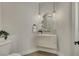 Stylish powder room with modern floating vanity, vessel sink, pendant lighting, and gold fixtures at 10277 Roma Madre Ave, Las Vegas, NV 89135
