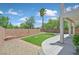 Well-kept backyard with artificial grass, stone details, and plenty of space at 11022 Saint Rafael St, Las Vegas, NV 89141