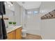 Bright bathroom with single sink, tub-shower, and towel hooks at 11022 Saint Rafael St, Las Vegas, NV 89141