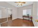 Cozy bedroom with wood floors, ceiling fan, and a mirrored closet at 11022 Saint Rafael St, Las Vegas, NV 89141