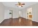 Spacious bedroom features hardwood floors, a ceiling fan, and a walk-in closet at 11022 Saint Rafael St, Las Vegas, NV 89141