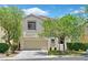 Charming two-story home with a well-maintained lawn and mature trees at 11022 Saint Rafael St, Las Vegas, NV 89141