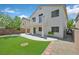 Rear exterior of the home featuring a balcony, patio, and landscaped backyard at 11022 Saint Rafael St, Las Vegas, NV 89141