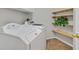 Bright laundry room with a full-sized washer and dryer and built-in shelving at 11022 Saint Rafael St, Las Vegas, NV 89141