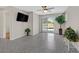 Living room with sliding glass door leading to backyard and decorative plant at 11022 Saint Rafael St, Las Vegas, NV 89141
