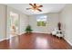 Expansive main bedroom featuring wood floors, a large window, and an ensuite bathroom at 11022 Saint Rafael St, Las Vegas, NV 89141