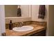 Bathroom features a single sink with decorative tile countertops, and a hand towel rack at 11731 Longworth Rd, Las Vegas, NV 89135