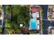 Aerial view of the community pool and recreational area with mature trees, lounge chairs and playground at 11731 Longworth Rd, Las Vegas, NV 89135