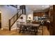 Open kitchen features stainless steel appliances, dark wood cabinets and a large dining table at 11731 Longworth Rd, Las Vegas, NV 89135