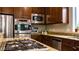 Modern kitchen boasts stainless steel appliances, granite countertops, and ample cabinet space at 11731 Longworth Rd, Las Vegas, NV 89135