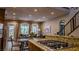 Open floor plan showcases a modern kitchen flowing into the living room with backyard access at 11731 Longworth Rd, Las Vegas, NV 89135