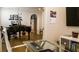 View from the office of the living room which has a grand piano, modern lighting and hardwood floors at 11731 Longworth Rd, Las Vegas, NV 89135