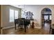 Elegant living room features a grand piano, modern lighting, and hardwood floors at 11731 Longworth Rd, Las Vegas, NV 89135