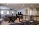 This loft features games, exercise equipment, comfortable seating, and plentiful natural light at 11731 Longworth Rd, Las Vegas, NV 89135