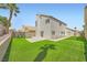 A backyard features a lush lawn at 1501 Lucia Dr, Las Vegas, NV 89128