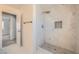 Bathroom featuring a stylish, tiled shower with mosaic flooring and a built-in shelf at 1501 Lucia Dr, Las Vegas, NV 89128