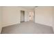 A bright and airy bedroom featuring neutral walls and soft carpet at 1501 Lucia Dr, Las Vegas, NV 89128