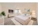 Staged bedroom featuring a bed, dresser, side tables, and modern decor at 1501 Lucia Dr, Las Vegas, NV 89128