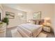 This bedroom features an art collection, a bed, two side tables, and a plant at 1501 Lucia Dr, Las Vegas, NV 89128