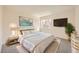 Bright bedroom showcases a comfy bed, a television, and decor at 1501 Lucia Dr, Las Vegas, NV 89128