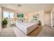 Staged bedroom with bed, carpet, side tables, dressers, and light neutral paint at 1501 Lucia Dr, Las Vegas, NV 89128