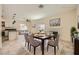 Cozy dining area featuring a modern table setting, fireplace, and open layout at 1501 Lucia Dr, Las Vegas, NV 89128