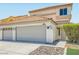 Two-story home featuring a tile roof, a two-car garage, and low-maintenance landscaping at 1501 Lucia Dr, Las Vegas, NV 89128