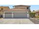 Charming two-story home with a spacious three-car garage, manicured landscaping, and beautiful tile roof at 1501 Lucia Dr, Las Vegas, NV 89128