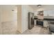 Well-lit kitchen showcases stainless steel appliances, sleek countertops, and white cabinets at 1501 Lucia Dr, Las Vegas, NV 89128