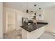 A modern kitchen featuring stainless steel appliances, granite countertops, and stylish lighting at 1501 Lucia Dr, Las Vegas, NV 89128