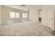 Open-concept living area with large windows, and modern tile flooring at 1501 Lucia Dr, Las Vegas, NV 89128