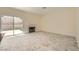 Spacious living room with tile floors, fireplace, and sliding door to backyard at 1501 Lucia Dr, Las Vegas, NV 89128