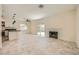 Bright open-concept living space with granite countertops and a cozy fireplace at 1501 Lucia Dr, Las Vegas, NV 89128