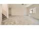 Spacious living room with tile flooring, staircase, and large windows providing natural light at 1501 Lucia Dr, Las Vegas, NV 89128