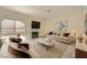 Beautiful staged living room featuring stylish furniture, decor, and a cozy ambiance at 1501 Lucia Dr, Las Vegas, NV 89128