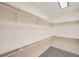 Walk-in closet featuring painted shelves and a carpeted floor at 1501 Lucia Dr, Las Vegas, NV 89128