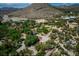 Sprawling property featuring a charming home nestled among lush trees, surrounded by picturesque mountain views at 18480 State Hwy 160, Las Vegas, NV 89161
