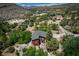 Beautiful mountain cabin and neighboring structures surrounded by lush trees and picturesque landscape at 18480 State Hwy 160, Las Vegas, NV 89161