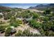 Quaint home surrounded by lush trees and a scenic backdrop, creating a serene and inviting residential setting at 18480 State Hwy 160, Las Vegas, NV 89161